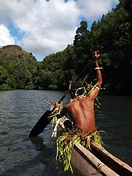 Paddling up McLaren Sound in an outrigger, Oro, Papua New Guinea
