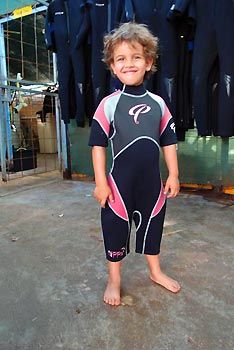 Max in his somewhat large wetsuit. Exmouth Diving Centre. Exmouth, Western Australia